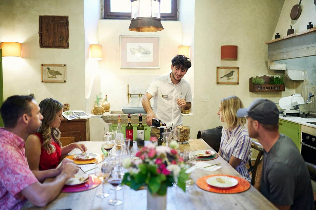 Florence: Chianti Wine Tour with Tasting & Tuscan Lunch At the table in our historic kitchen