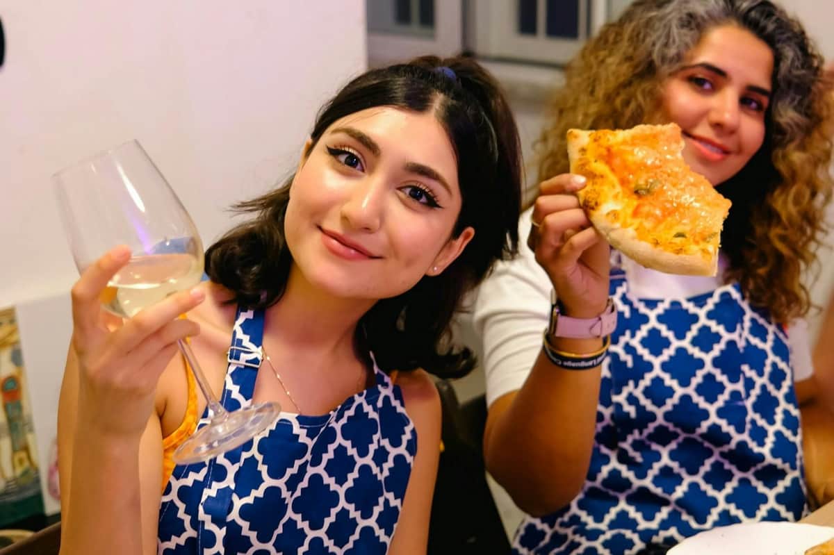 Rome: Paint & Sip Class + Unlimited Wine Enjoying wine and Pizza